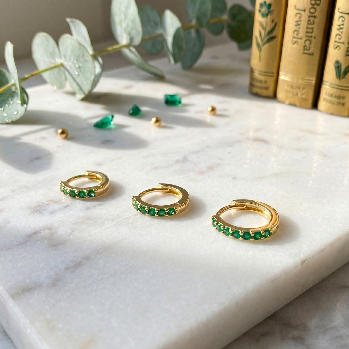 Emerald huggie hoop